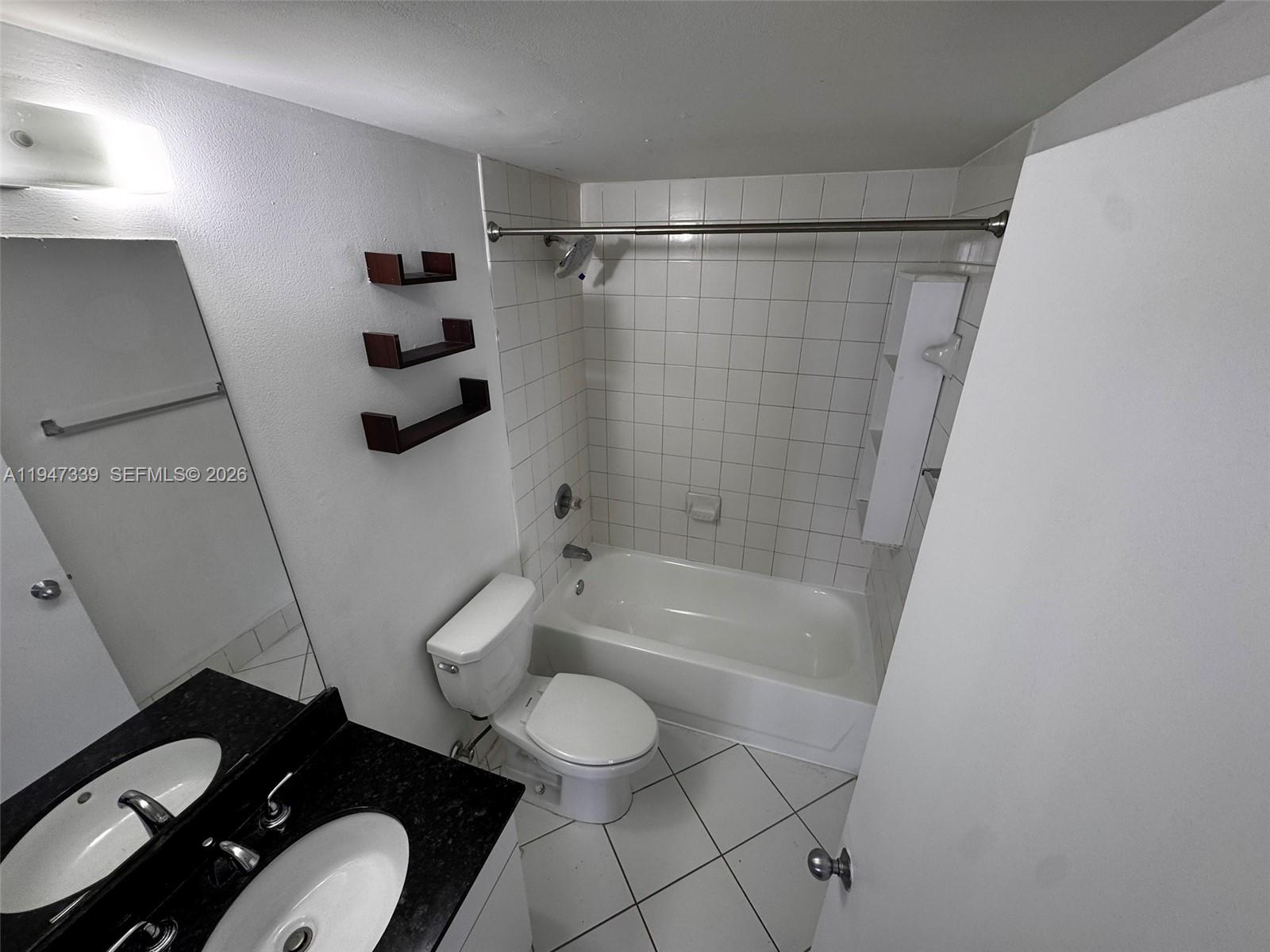 701 Brickell Key Boulevard, Unit 1208 Miami, FL 33131 - Photo 7 of 14 a bathroom with a toilet and a shower