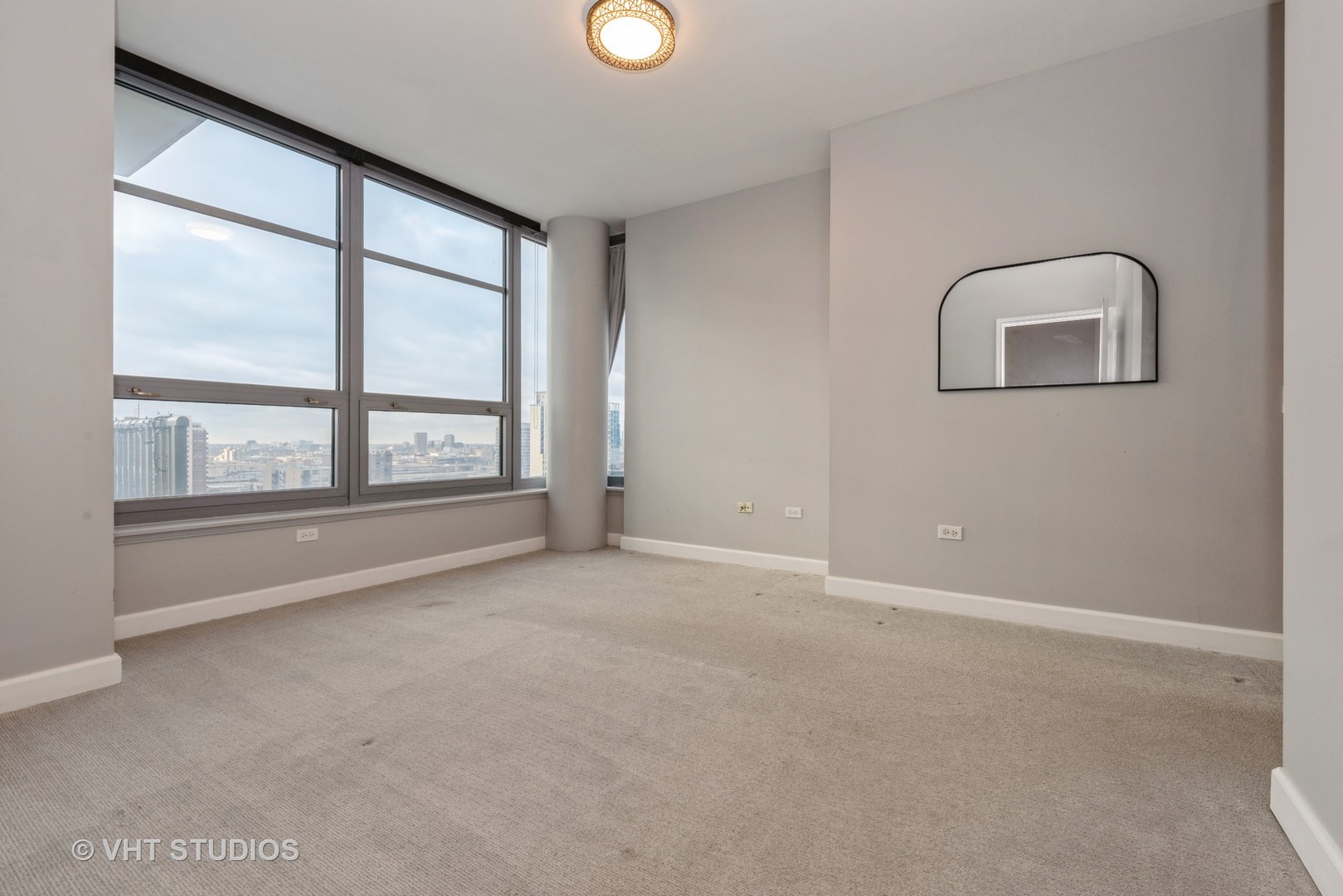 1600 South Prairie Avenue, Unit 2005 Chicago, IL 60616 - Photo 6 of 12 a view of an empty room with a window