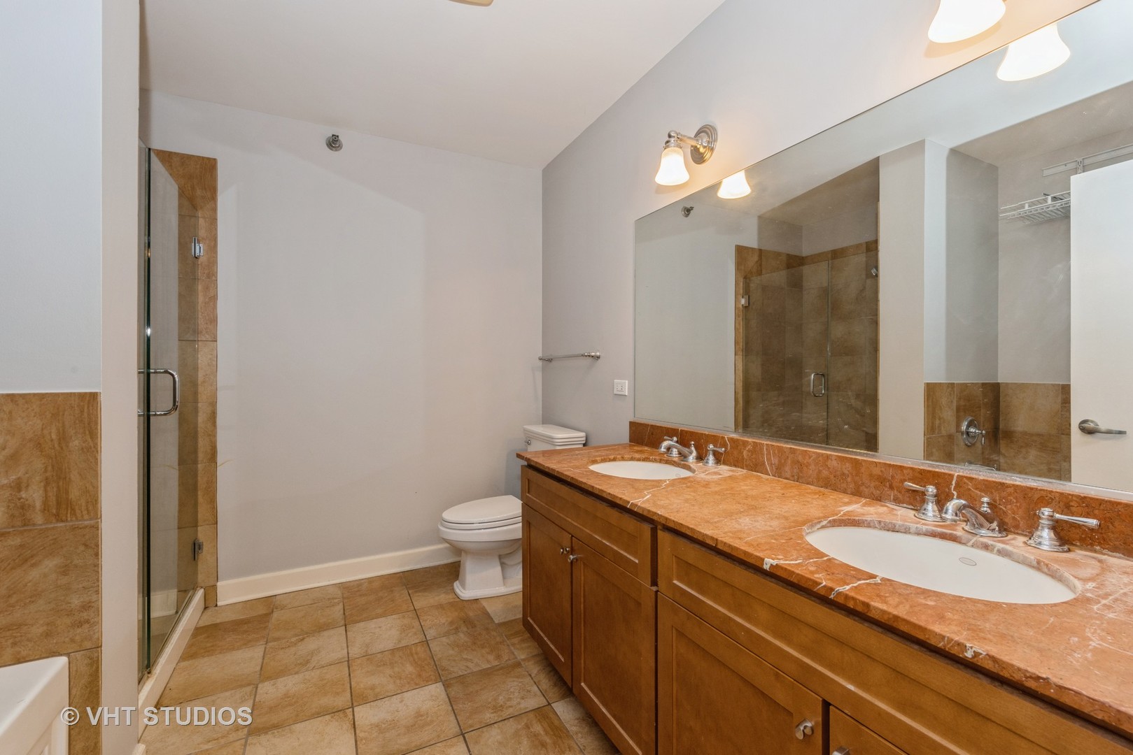 1600 South Prairie Avenue, Unit 2005 Chicago, IL 60616 - Photo 8 of 12 a bathroom with a sink and a mirror