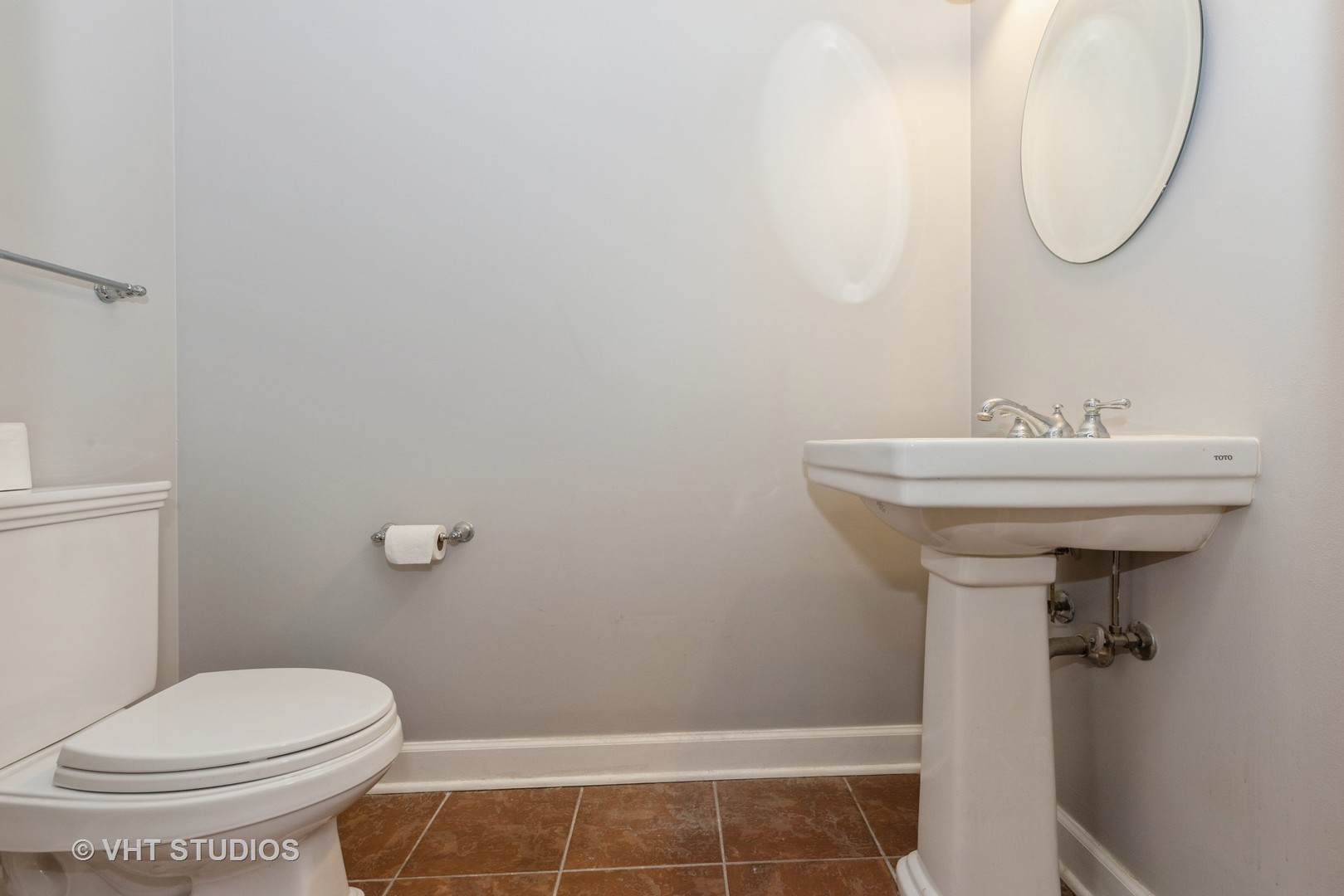 1600 South Prairie Avenue, Unit 2005 Chicago, IL 60616 - Photo 9 of 12 a bathroom with a sink toilet and a mirror