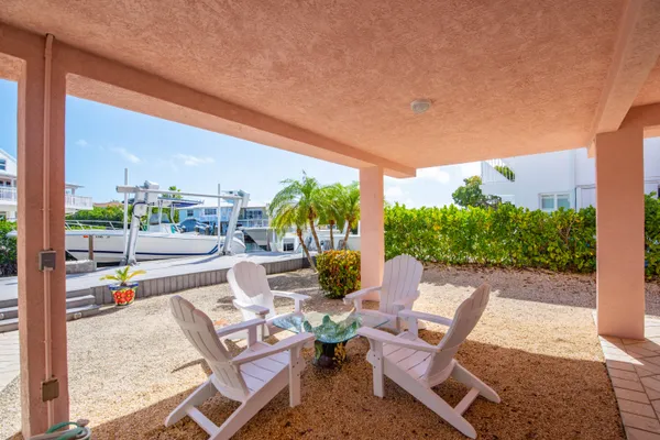 a view of a swimming pool with sitting area