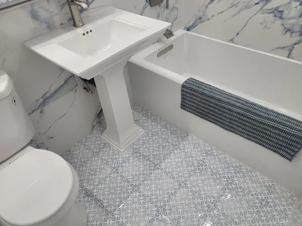 a view of a balcony with chairs