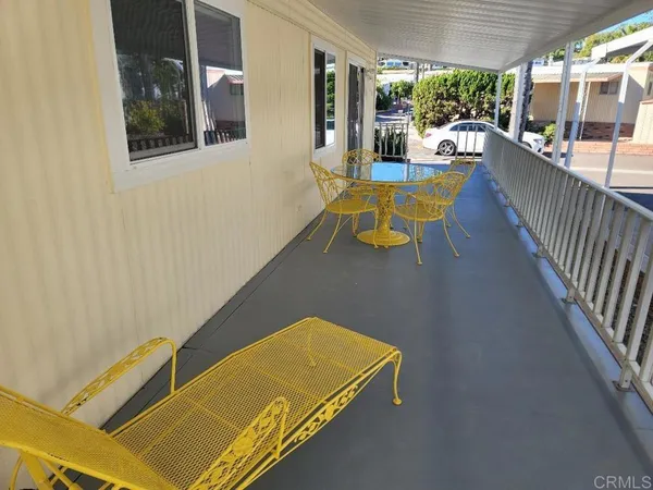 a view of a room with a table and chairs