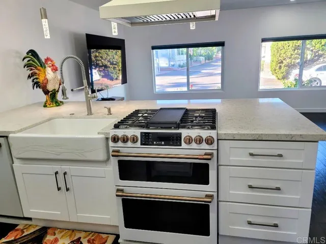 a kitchen with a stove and a microwave