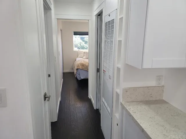 a view of hallway with wooden floor