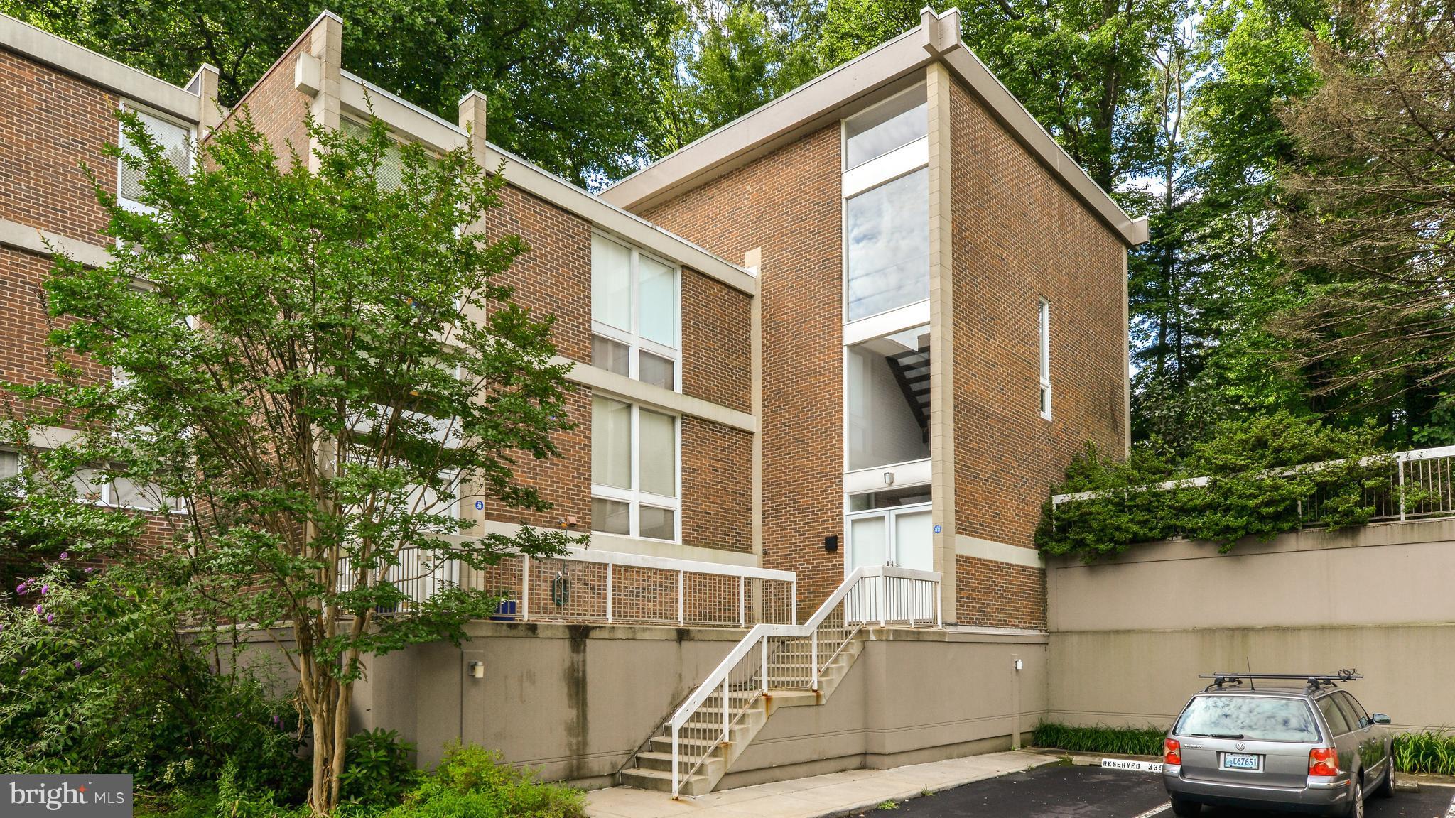 11533 Hickory Cluster Reston, VA 20190 - Photo 1 of 30 a front view of a house with a yard