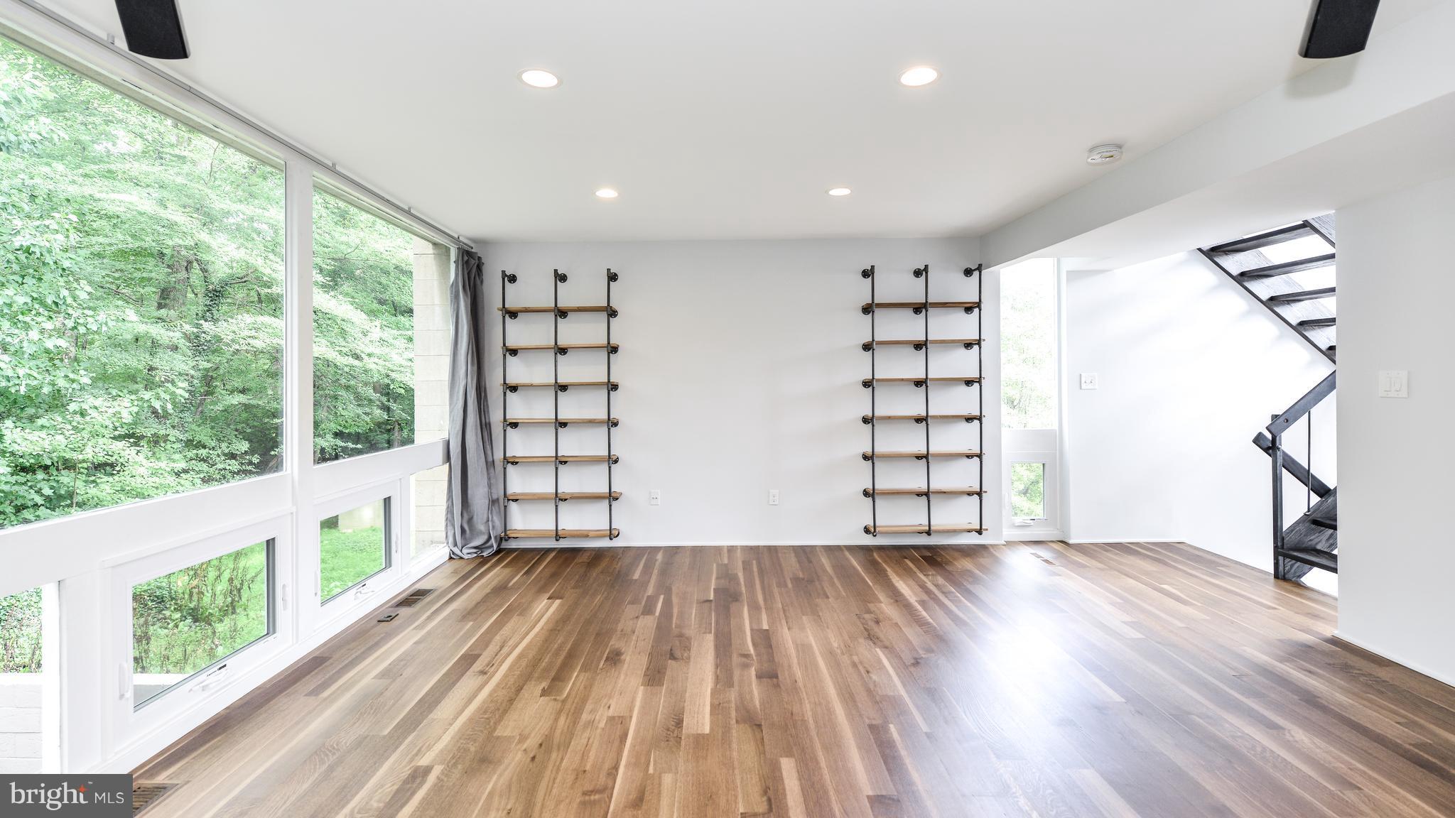 11533 Hickory Cluster Reston, VA 20190 - Photo 11 of 30 a view of empty room with wooden floor and fan
