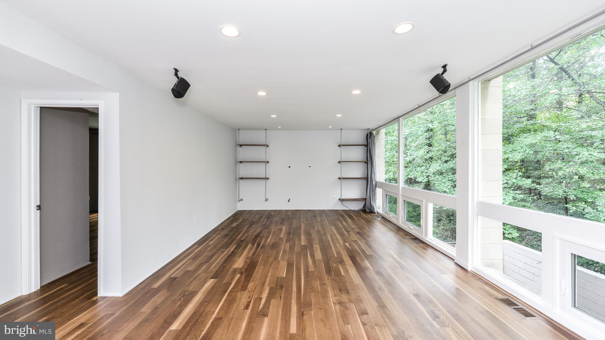 11533 Hickory Cluster Reston, VA 20190 - Photo 12 of 30 wooden floor in an empty room with a window