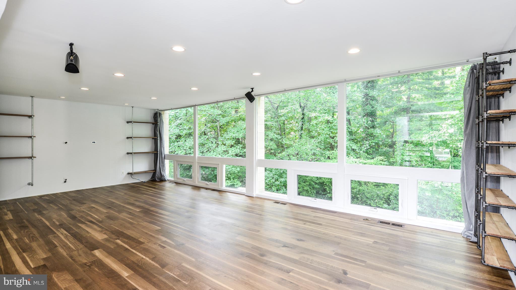 11533 Hickory Cluster Reston, VA 20190 - Photo 13 of 30 a view of an empty room with wooden floor and a window