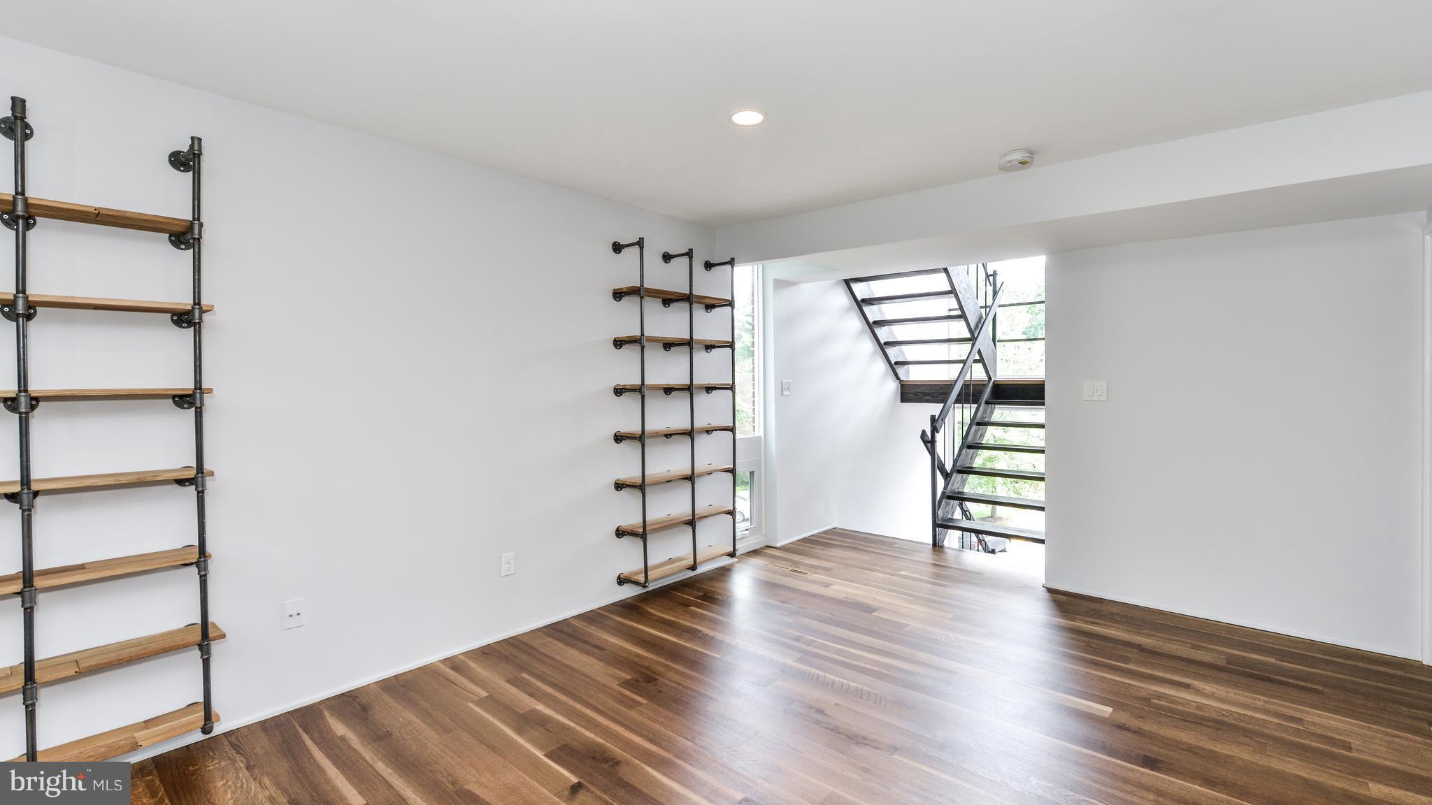 11533 Hickory Cluster Reston, VA 20190 - Photo 14 of 30 wooden floor in an empty room with a window