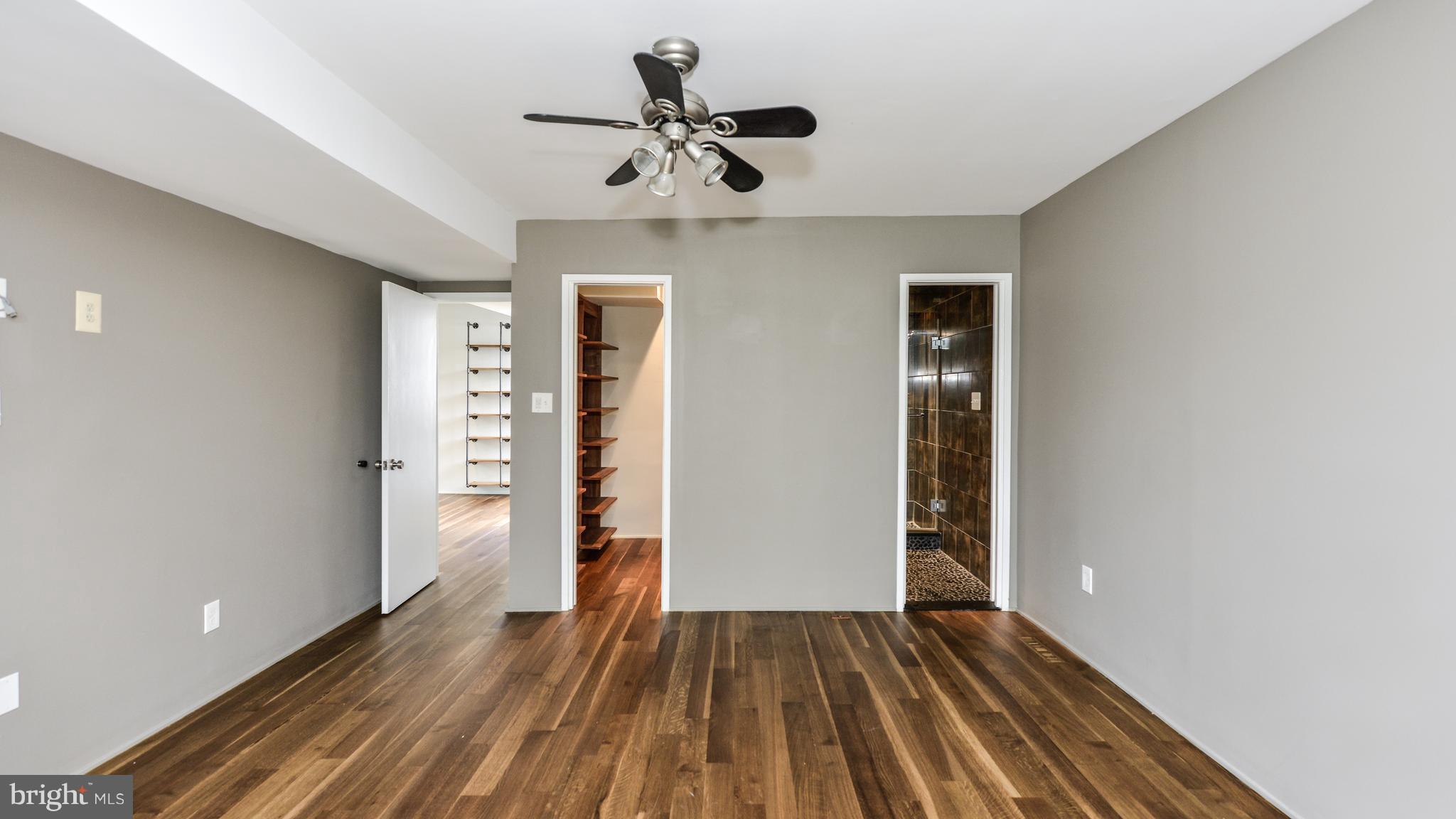 11533 Hickory Cluster Reston, VA 20190 - Photo 18 of 30 wooden floor in an empty room with a window