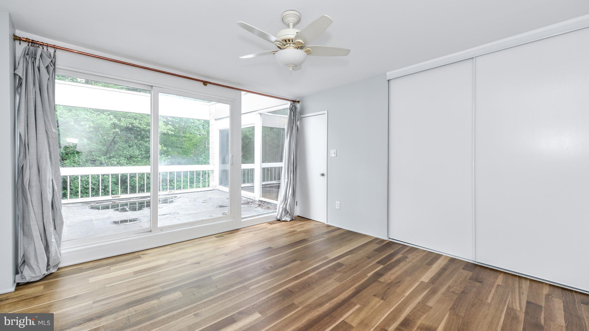 11533 Hickory Cluster Reston, VA 20190 - Photo 20 of 30 a view of empty room with wooden floor and fan