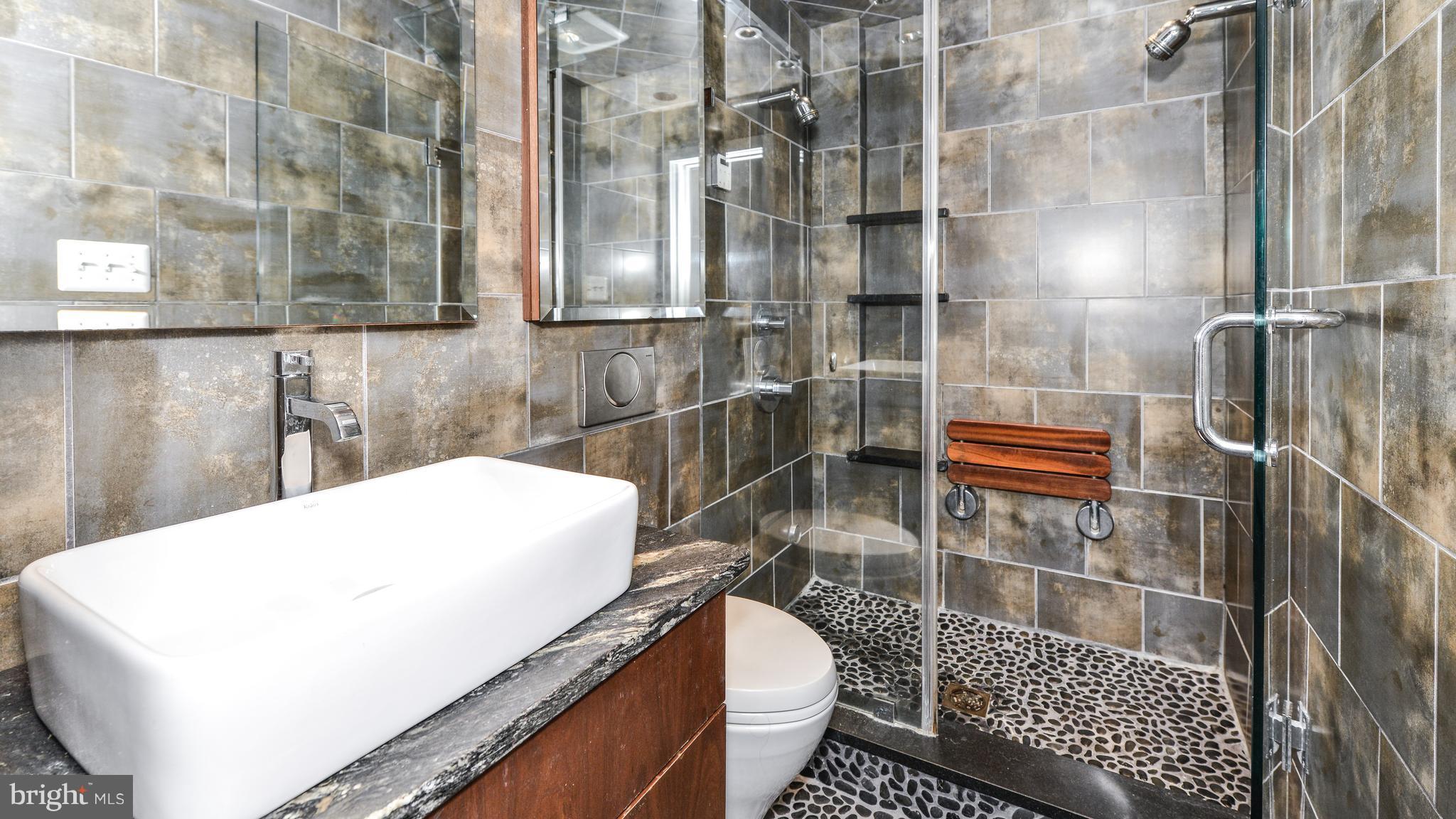 11533 Hickory Cluster Reston, VA 20190 - Photo 22 of 30 a bathroom with a shower