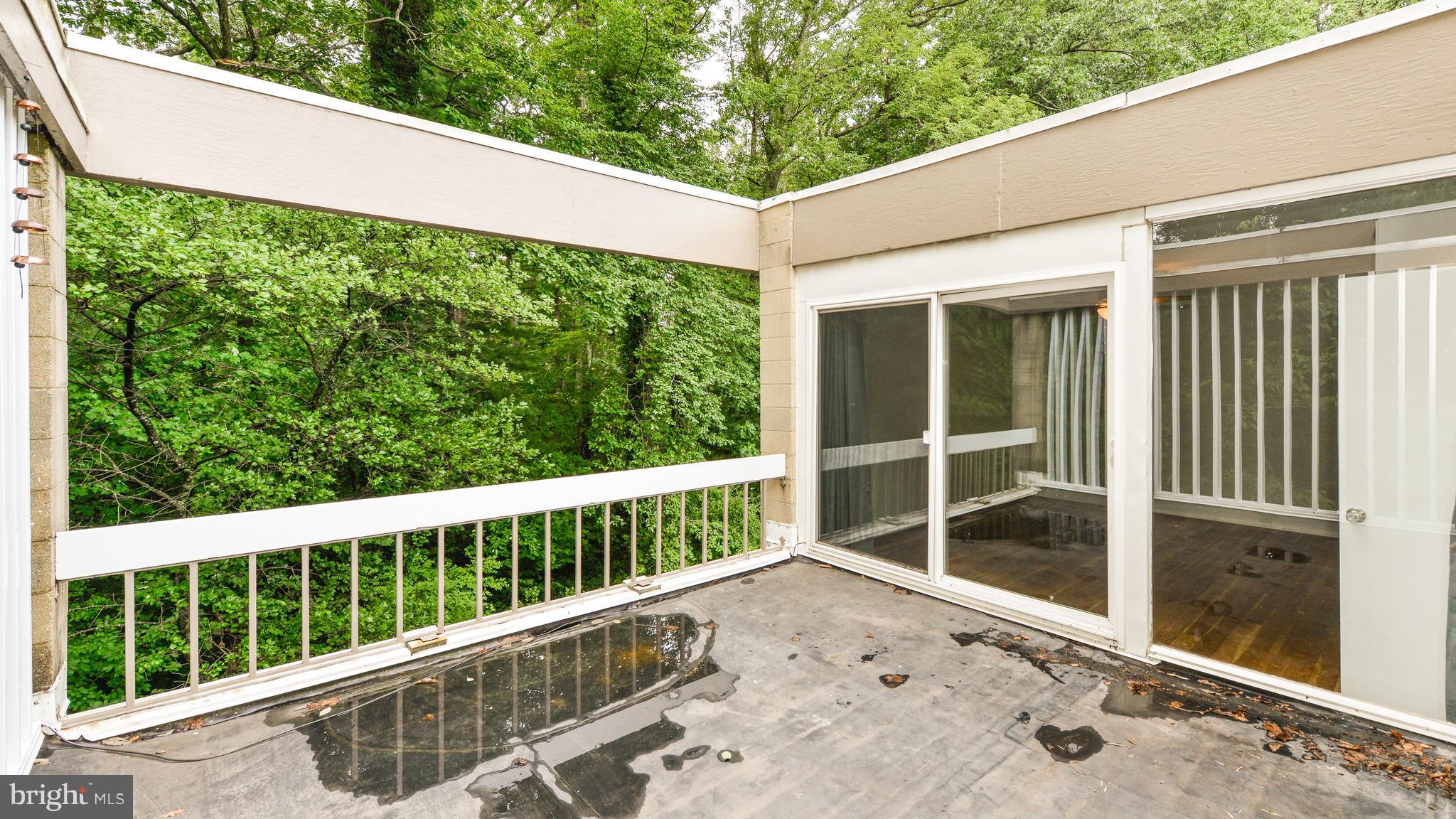 11533 Hickory Cluster Reston, VA 20190 - Photo 26 of 30 a balcony with view of an outdoor space