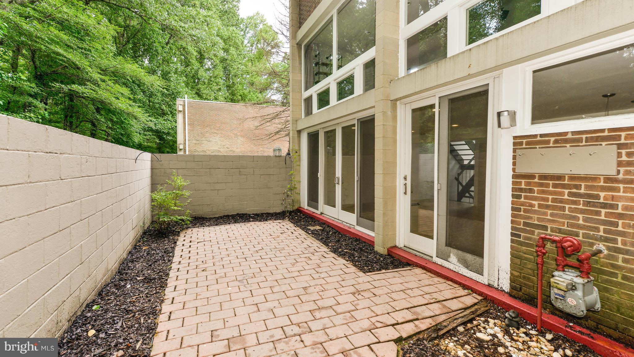 11533 Hickory Cluster Reston, VA 20190 - Photo 27 of 30 a view of a building with a book shelf