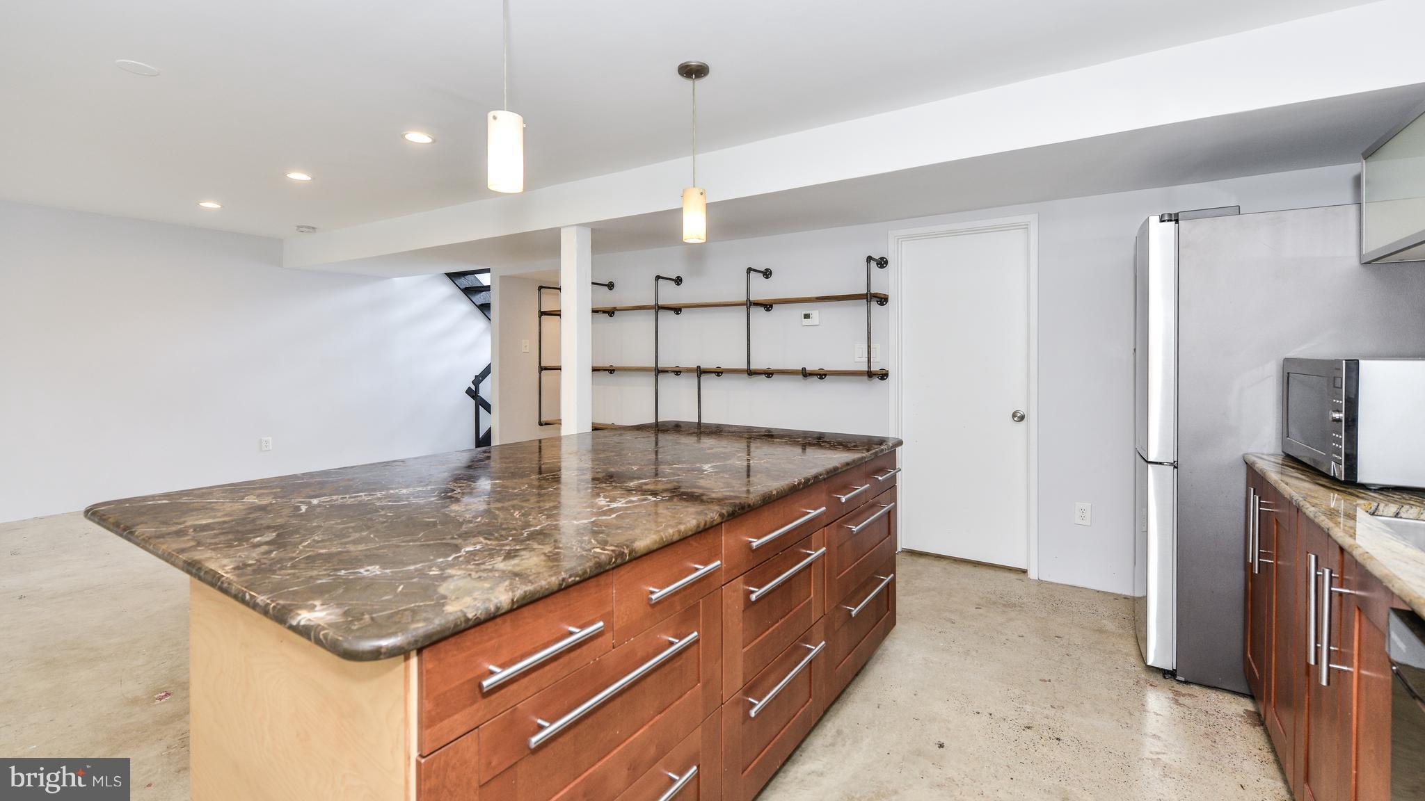 11533 Hickory Cluster Reston, VA 20190 - Photo 4 of 30 a kitchen with stainless steel appliances granite countertop a sink a counter top space and cabinets