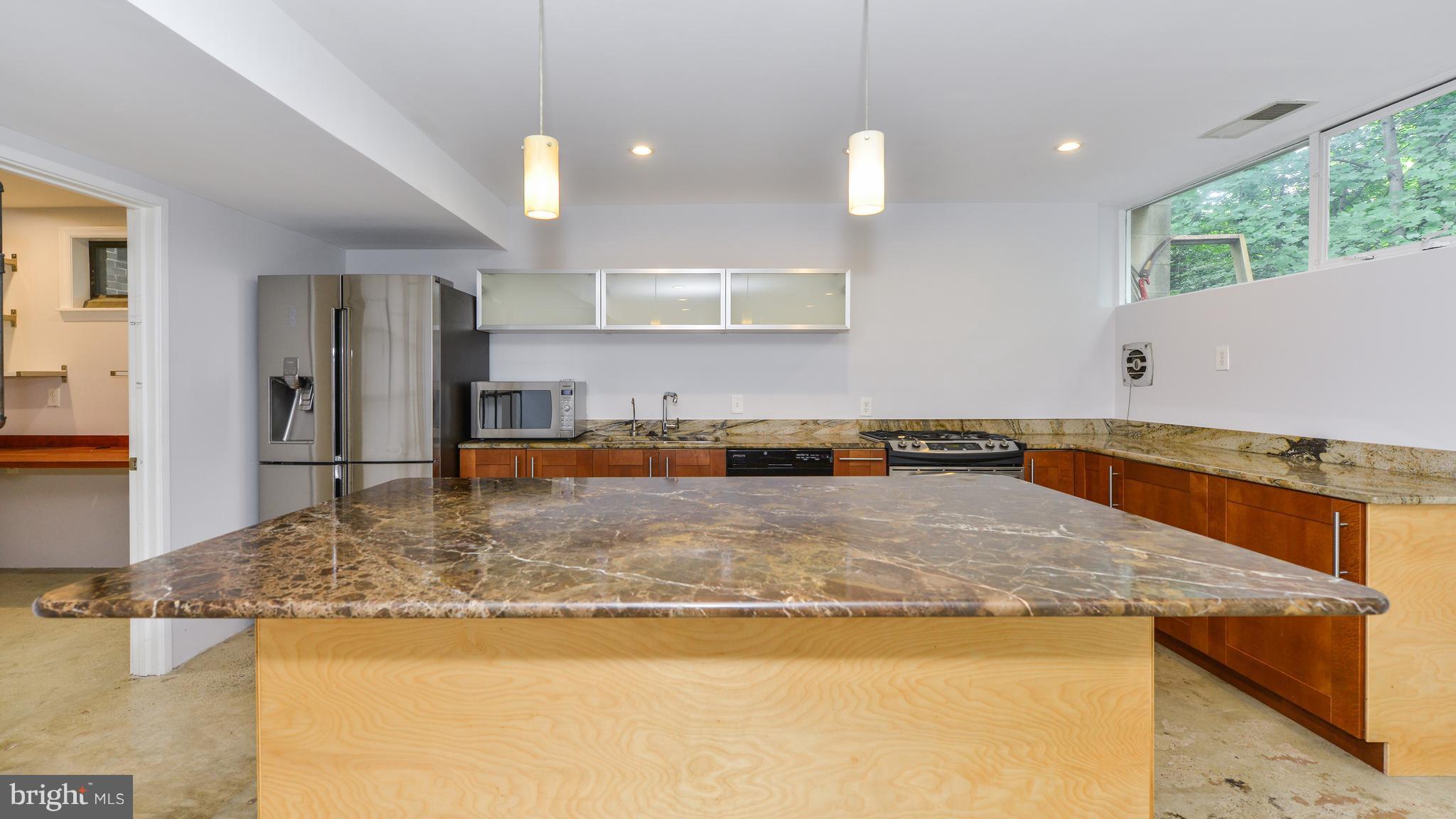 11533 Hickory Cluster Reston, VA 20190 - Photo 6 of 30 a kitchen with a stove a faucet a sink and a refrigerator