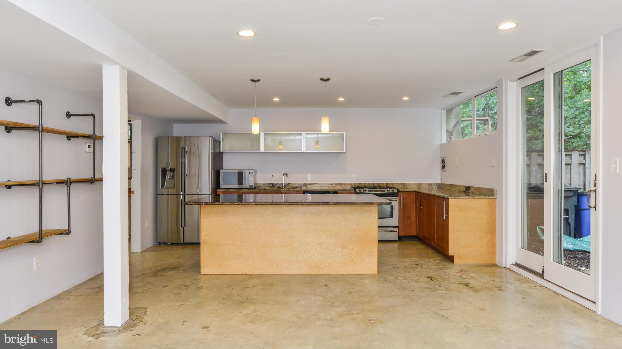11533 Hickory Cluster Reston, VA 20190 - Photo 8 of 30 a view of a kitchen with a refrigerator and a sink