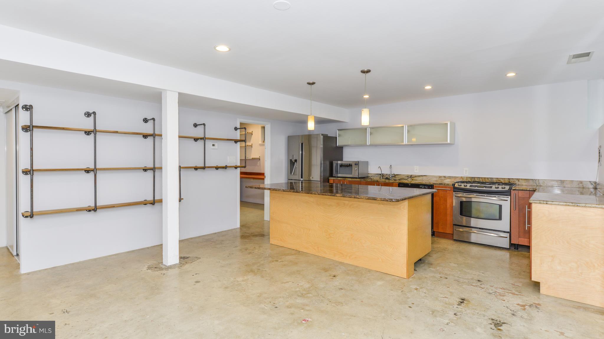 11533 Hickory Cluster Reston, VA 20190 - Photo 9 of 30 a kitchen with refrigerator and cabinets