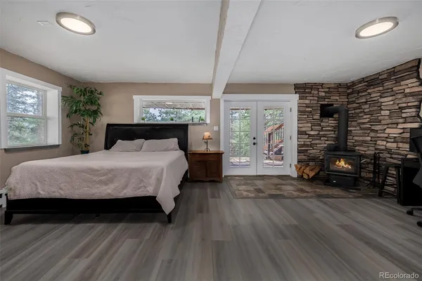 a spacious bedroom with a bed and a window
