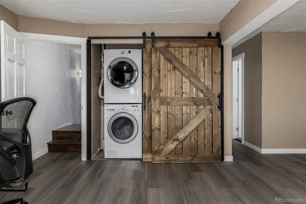 a view of a hallway with washer and dryer