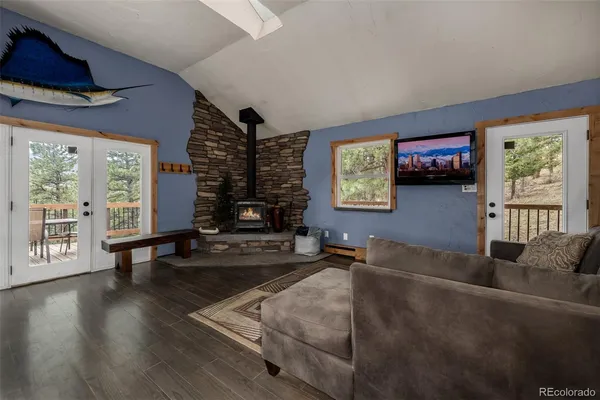 a living room with furniture window and wooden floor