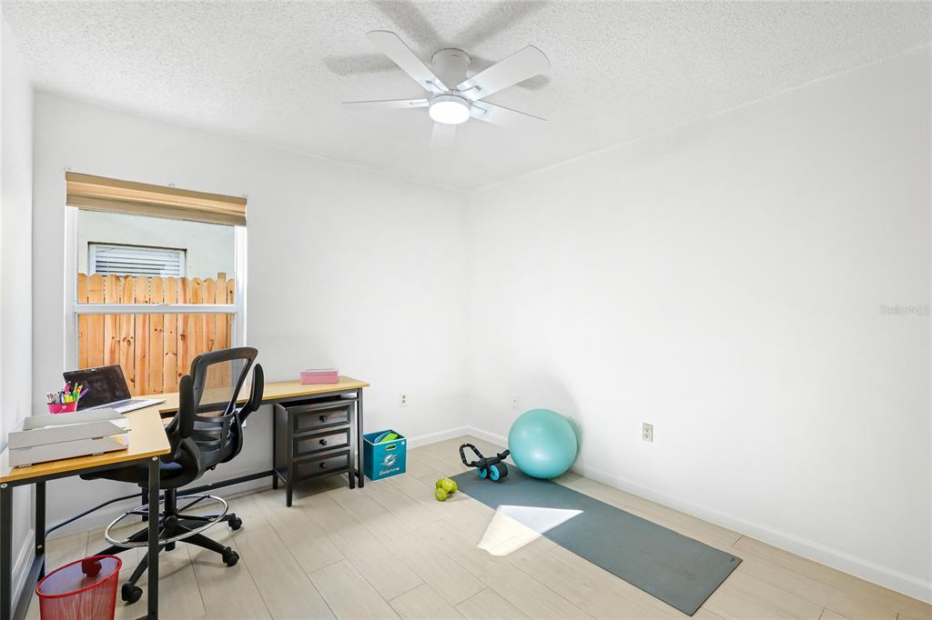 4537 South Lockwood Ridge Road Sarasota, FL 34231 - Photo 18 of 22 a view of workspace with wooden floor