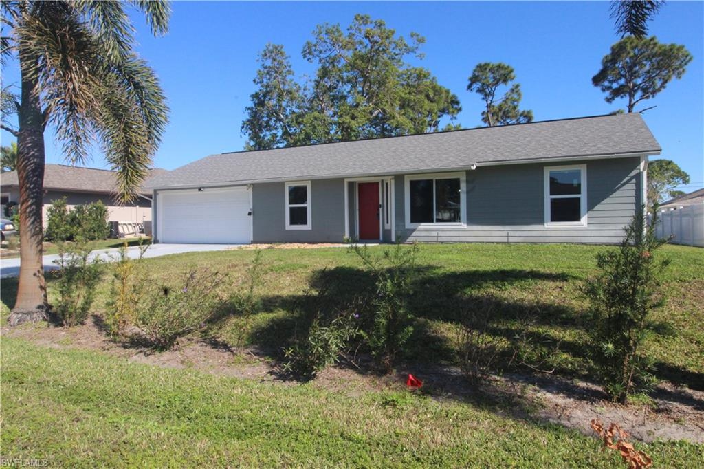 18257 Sycamore Road Fort Myers, FL 33967 - Photo 15 of 19 Ranch-style house featuring a front yard and a garage