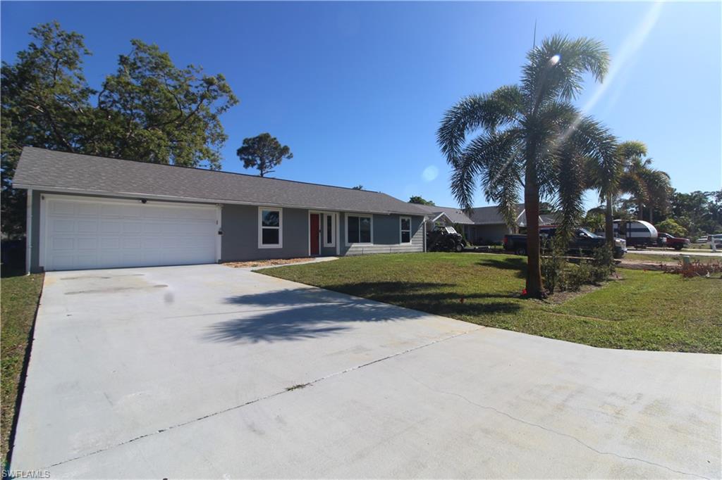 18257 Sycamore Road Fort Myers, FL 33967 - Photo 16 of 19 Ranch-style house featuring a garage and a front lawn