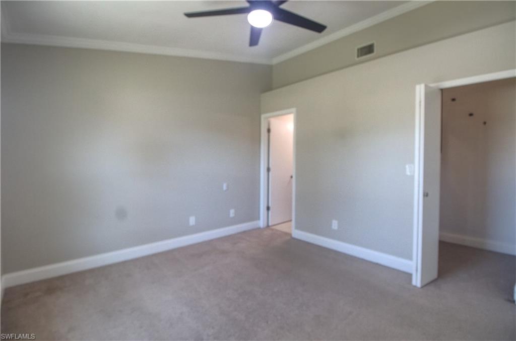18257 Sycamore Road Fort Myers, FL 33967 - Photo 6 of 19 Master bedroom with carpet flooring, ceiling fan, and crown molding