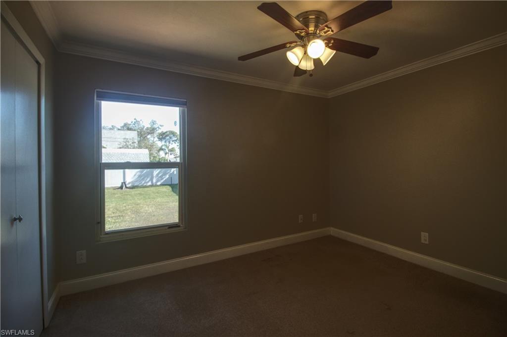18257 Sycamore Road Fort Myers, FL 33967 - Photo 8 of 19 Guest room 1 featuring ceiling fan and crown molding