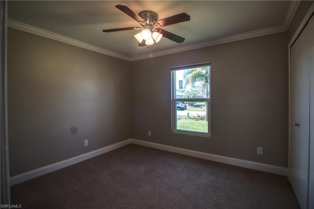 18257 Sycamore Road Fort Myers, FL 33967 - Photo 9 of 19 Guest bedroom 2 featuring crown molding and ceiling fan