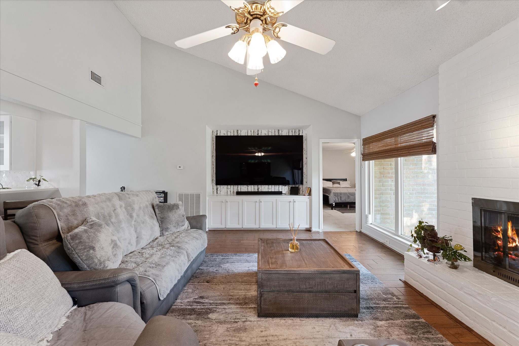 11854 Briar Forest Drive Houston, TX 77077 - Photo 12 of 21 a living room with furniture and a flat screen tv