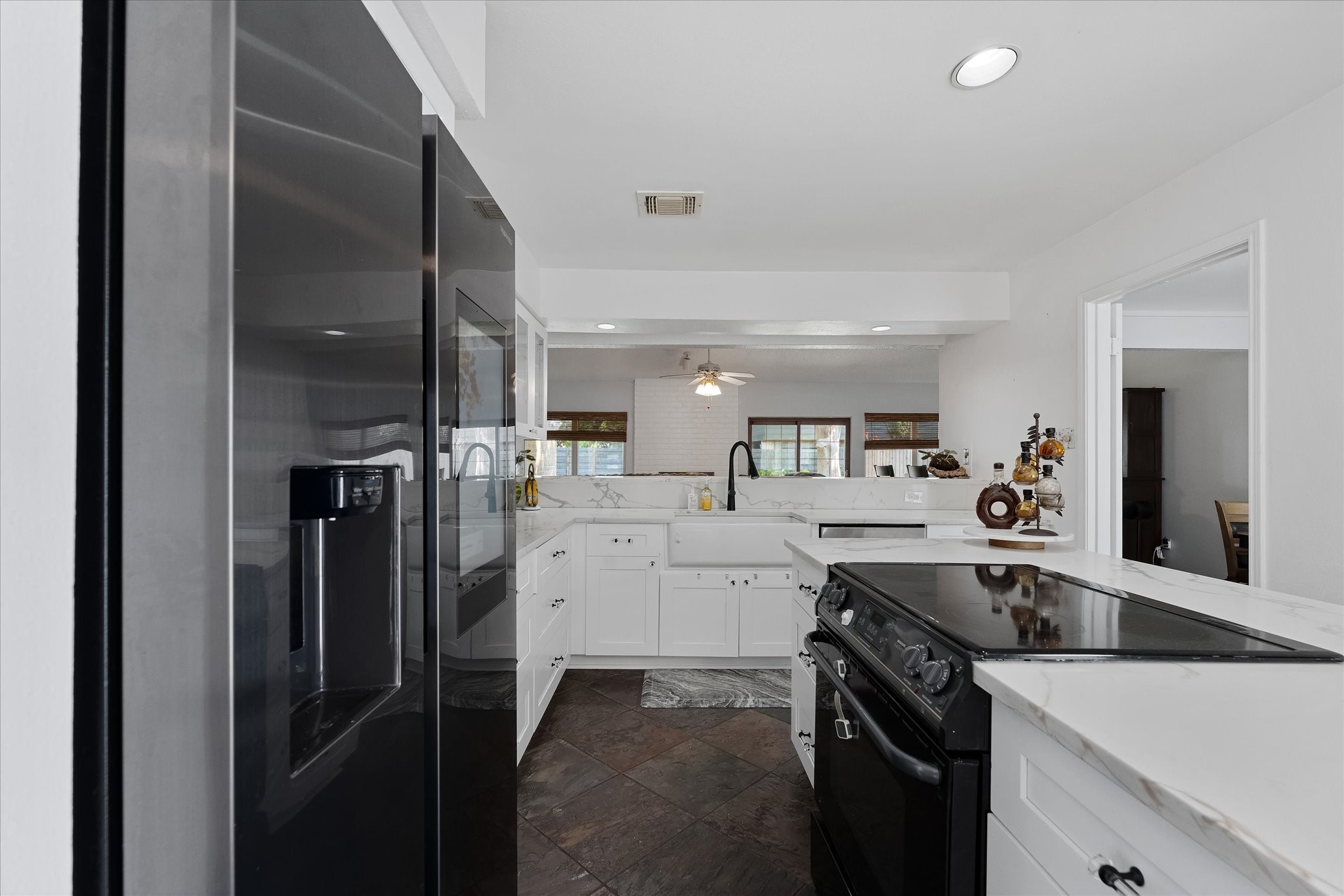 11854 Briar Forest Drive Houston, TX 77077 - Photo 5 of 21 a kitchen with a sink stainless steel appliances and cabinets