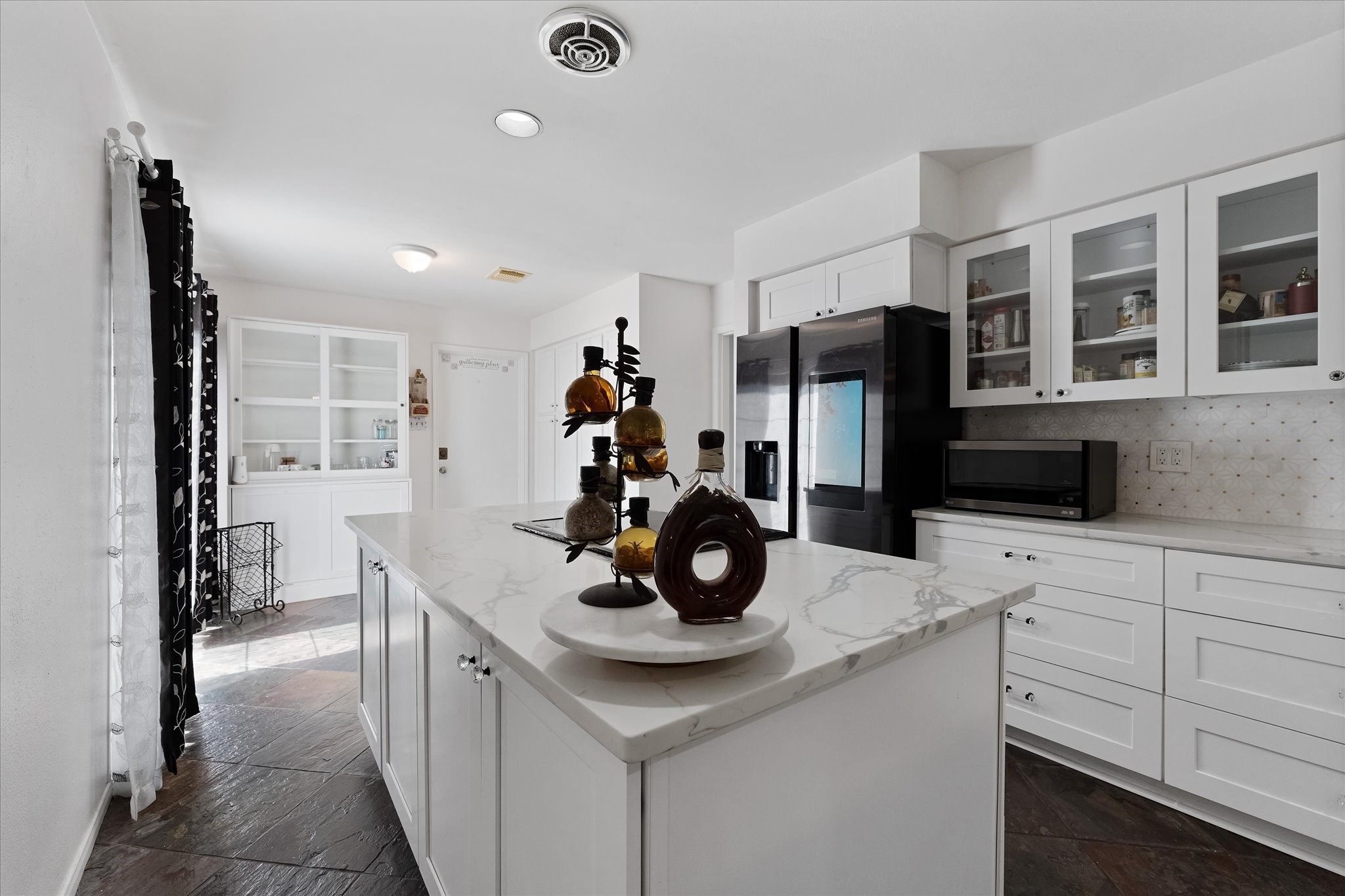 11854 Briar Forest Drive Houston, TX 77077 - Photo 7 of 21 a kitchen with a sink appliances and cabinets