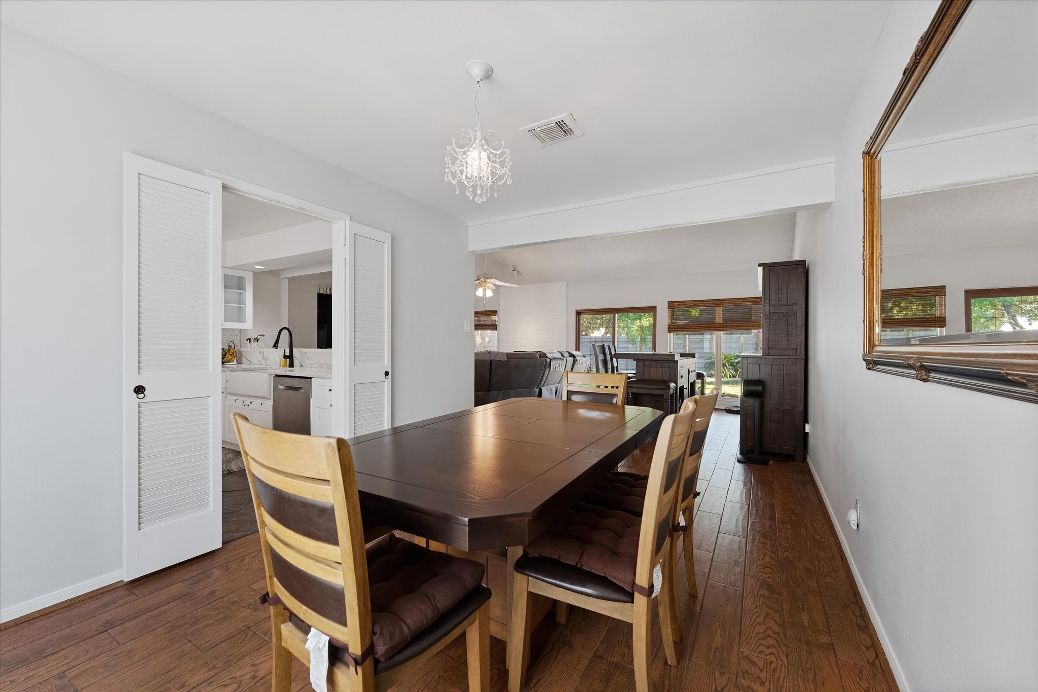 11854 Briar Forest Drive Houston, TX 77077 - Photo 8 of 21 a view of a dining room with furniture and wooden floor
