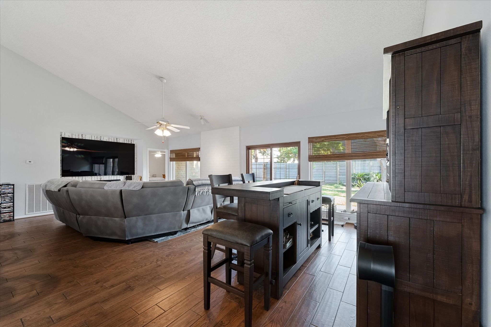 11854 Briar Forest Drive Houston, TX 77077 - Photo 9 of 21 a living room with furniture and a flat screen tv