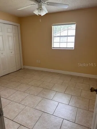 a view of an empty room with a window