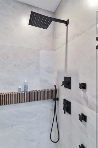 a bathroom with a shower and a bathtub