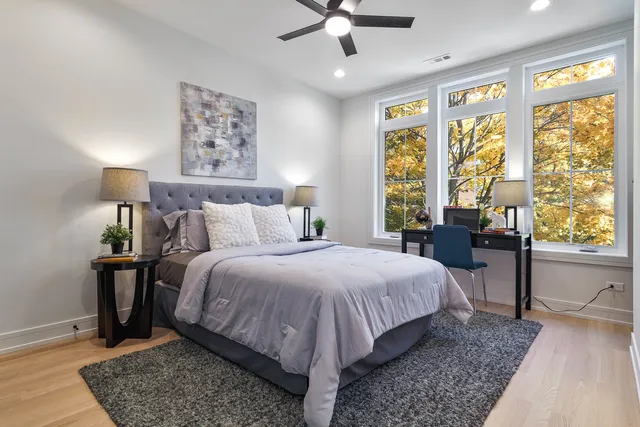 a bed room with a bed and a window