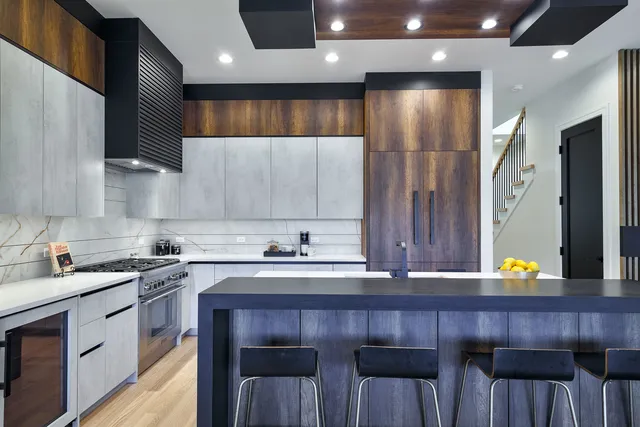 a kitchen with a sink cabinets and wooden floor