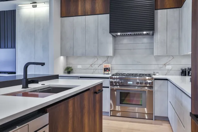 a kitchen with a sink and cabinets