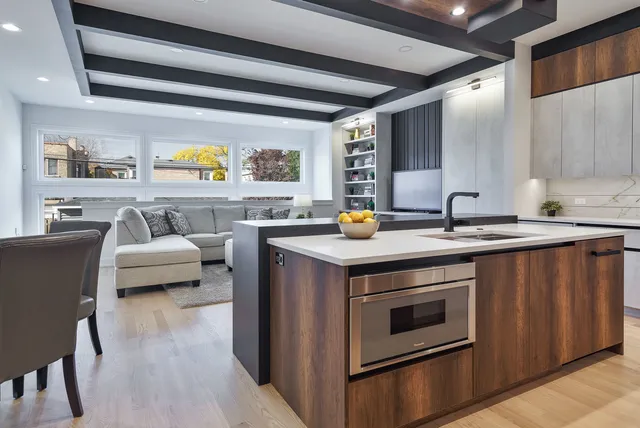 a kitchen with a sink a stove and cabinets