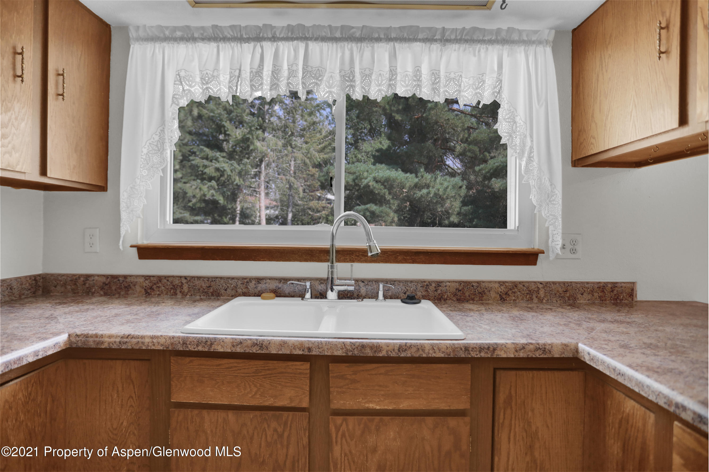 770 Bridger Circle Craig, CO 81625 - Photo 11 of 32 a bathroom with a granite countertop sink and a mirror