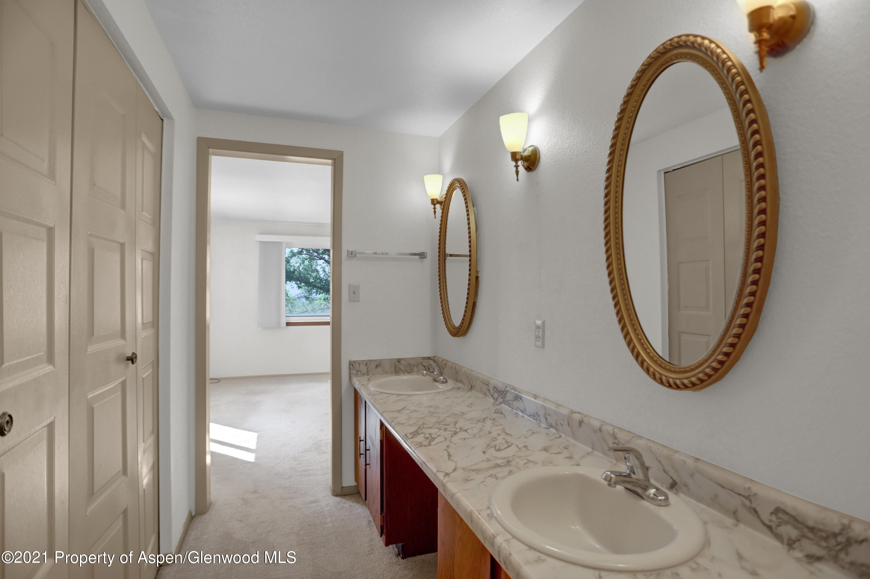770 Bridger Circle Craig, CO 81625 - Photo 15 of 32 a bathroom with a sink and a mirror