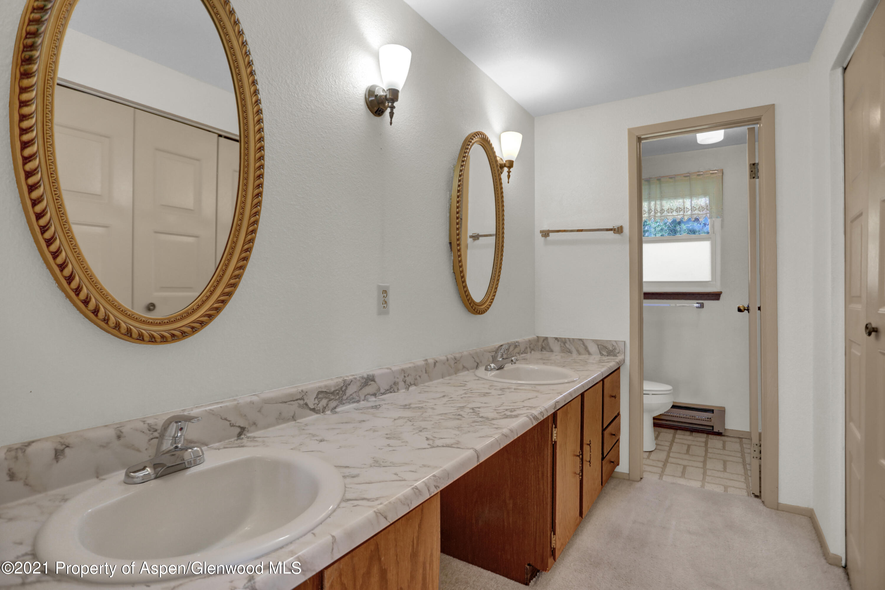 770 Bridger Circle Craig, CO 81625 - Photo 16 of 32 a bathroom with a sink and a mirror