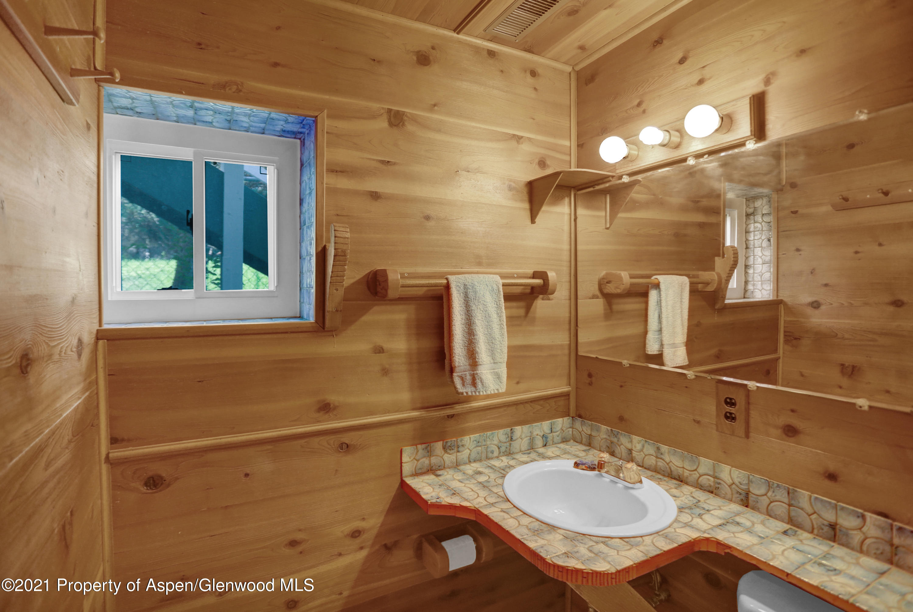 770 Bridger Circle Craig, CO 81625 - Photo 25 of 32 a bathroom with a sink and a mirror