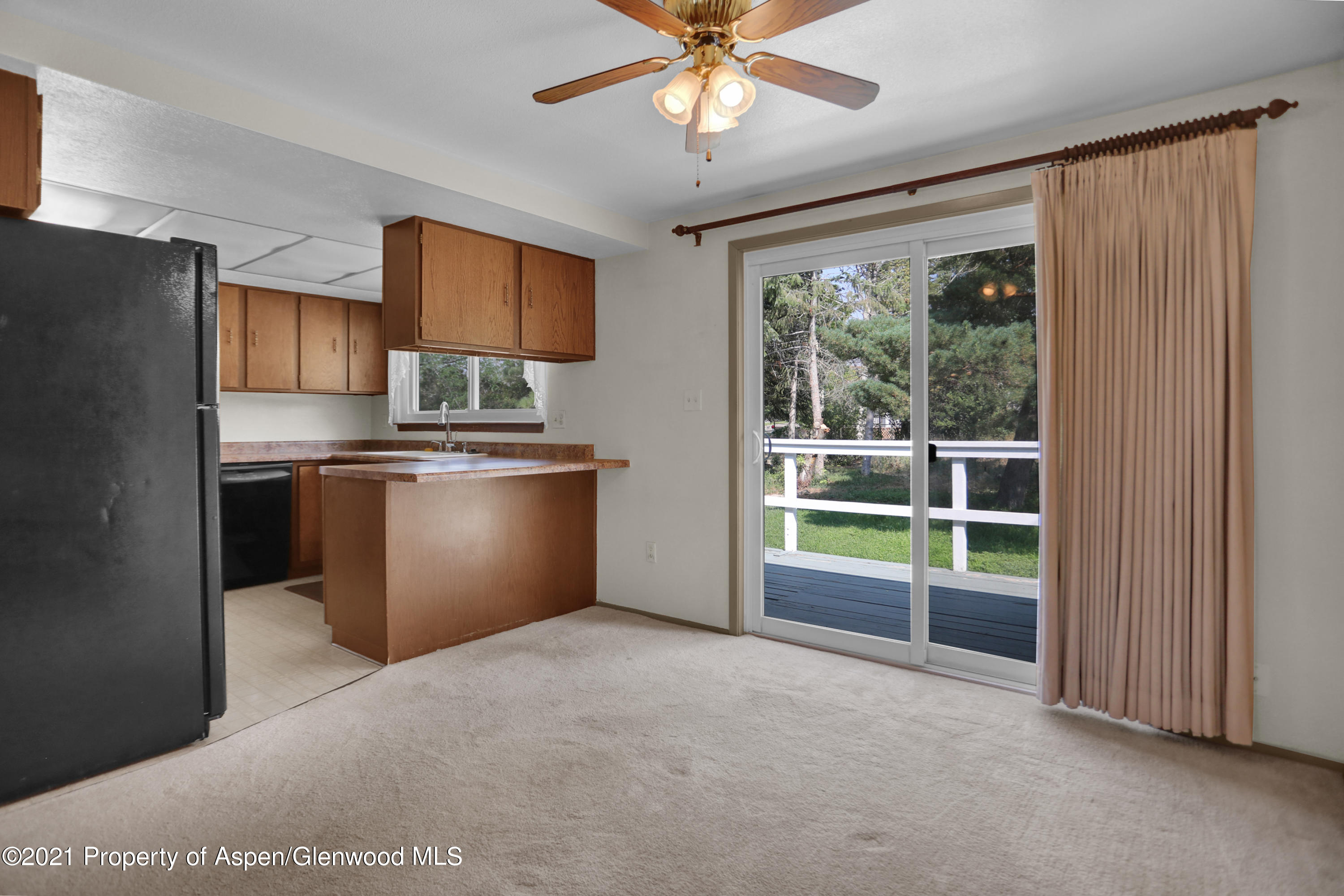 770 Bridger Circle Craig, CO 81625 - Photo 7 of 32 a view of kitchen with window cabinet and refrigerator