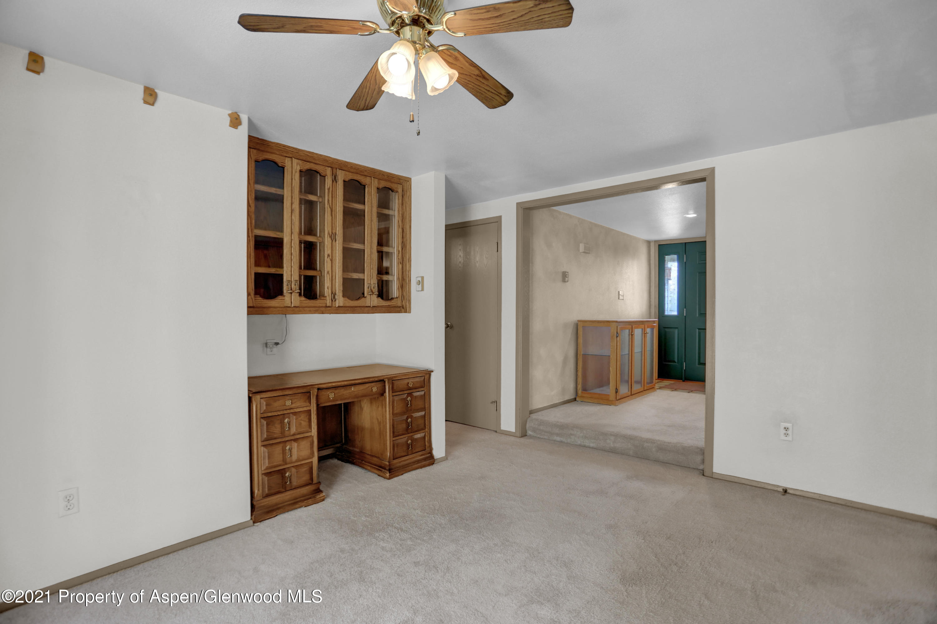 770 Bridger Circle Craig, CO 81625 - Photo 8 of 32 an empty room with windows and cabinet
