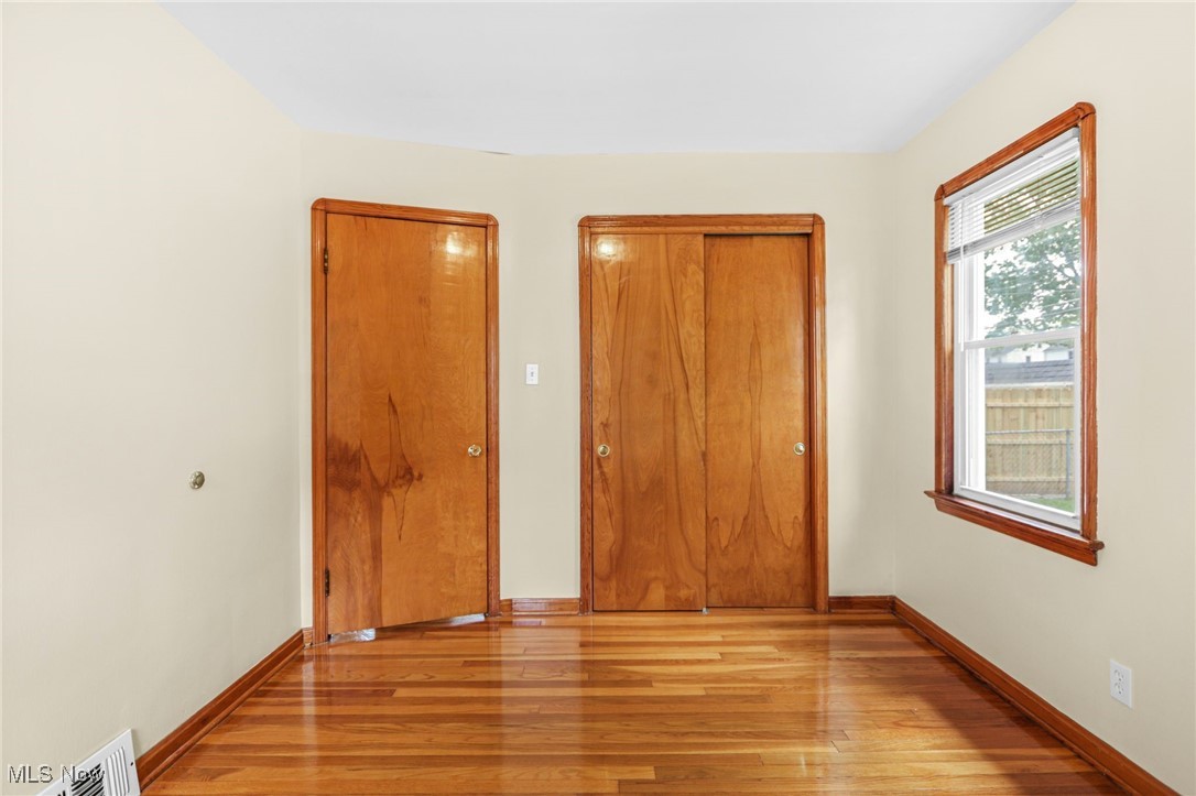 3205 George Avenue Cleveland, OH 44134 - Photo 19 of 32 Unfurnished bedroom with light wood-style flooring and a closet